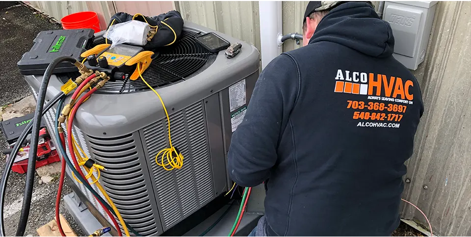 Skilled contractor performing HVAC maintenance