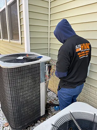 Skilled contractor repairing an HVAC unit