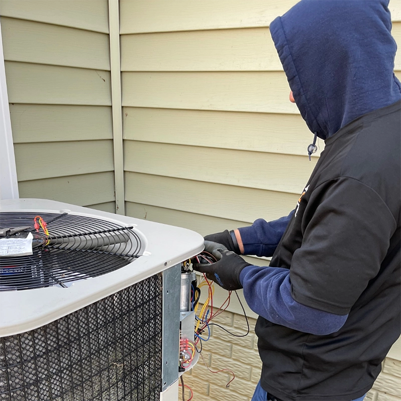 image of ALCO HVAC technician preforming heating repair service in Fredericksburg, VA