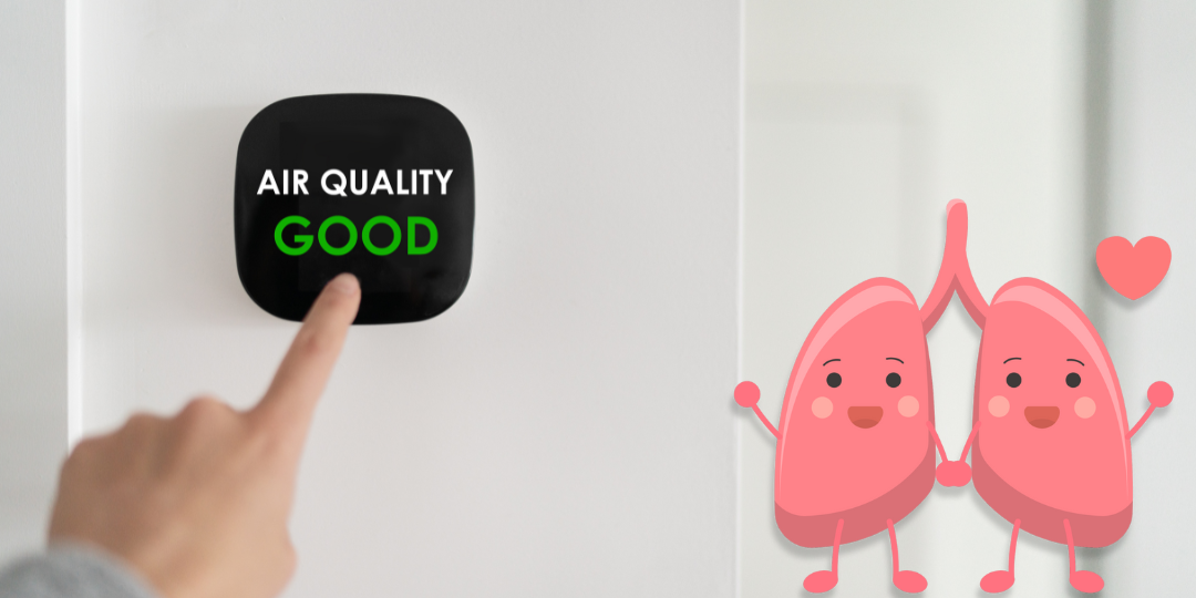 image of indoor air quality monitor showing good air quality and cartoon happy lungs in love.